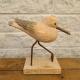 Sculpture d'oiseau en bois sur pattes de métal base de bois